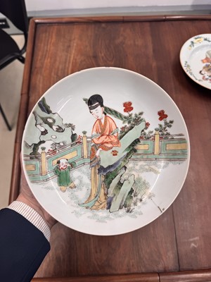 Lot 21 - A fine pair of Chinese famille-verte ‘lady and child’ dishes, Qing dynasty, Kangxi period