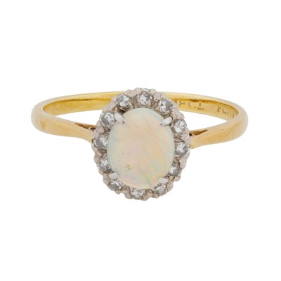 Lot 125 - A white opal and diamond halo ring