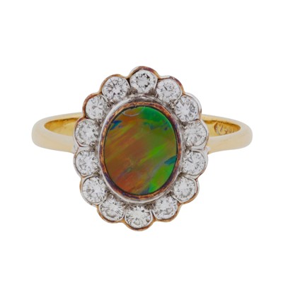 Lot 136 - A black opal and diamond halo ring