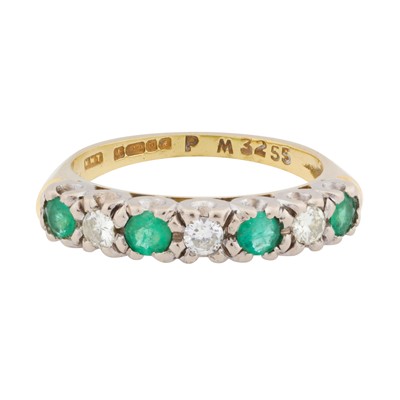 Lot 112 - An emerald and diamond seven stone ring, circa 1975