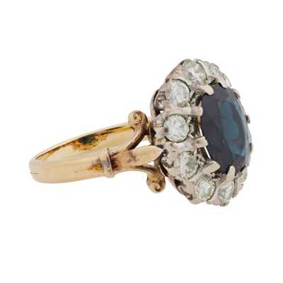 Lot 30 - A sapphire and diamond halo ring