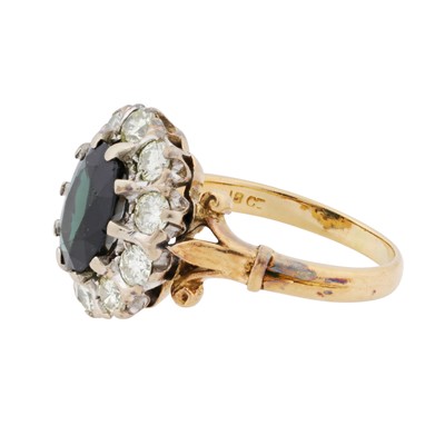 Lot 30 - A sapphire and diamond halo ring