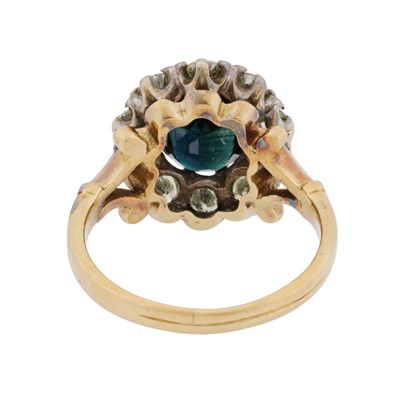 Lot 30 - A sapphire and diamond halo ring