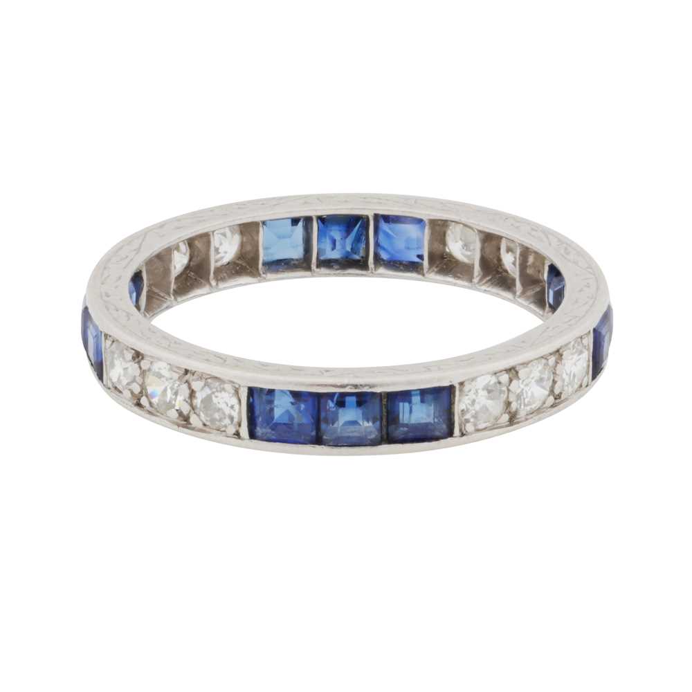 Lot 51 - A sapphire and diamond full eternity ring