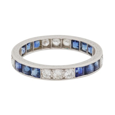 Lot 51 - A sapphire and diamond full eternity ring