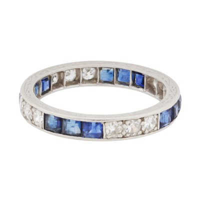 Lot 51 - A sapphire and diamond full eternity ring