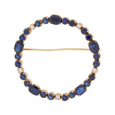 Lot 28 - A circular diamond and sapphire brooch