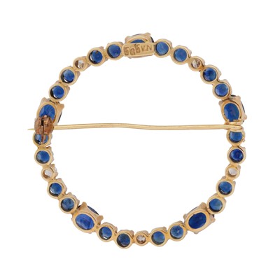 Lot 28 - A circular diamond and sapphire brooch