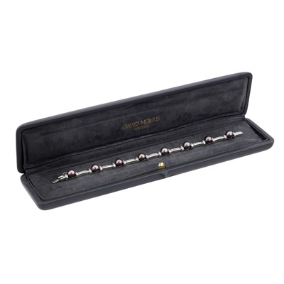 Lot 90 - David Morris Ι A black pearl and diamond line bracelet