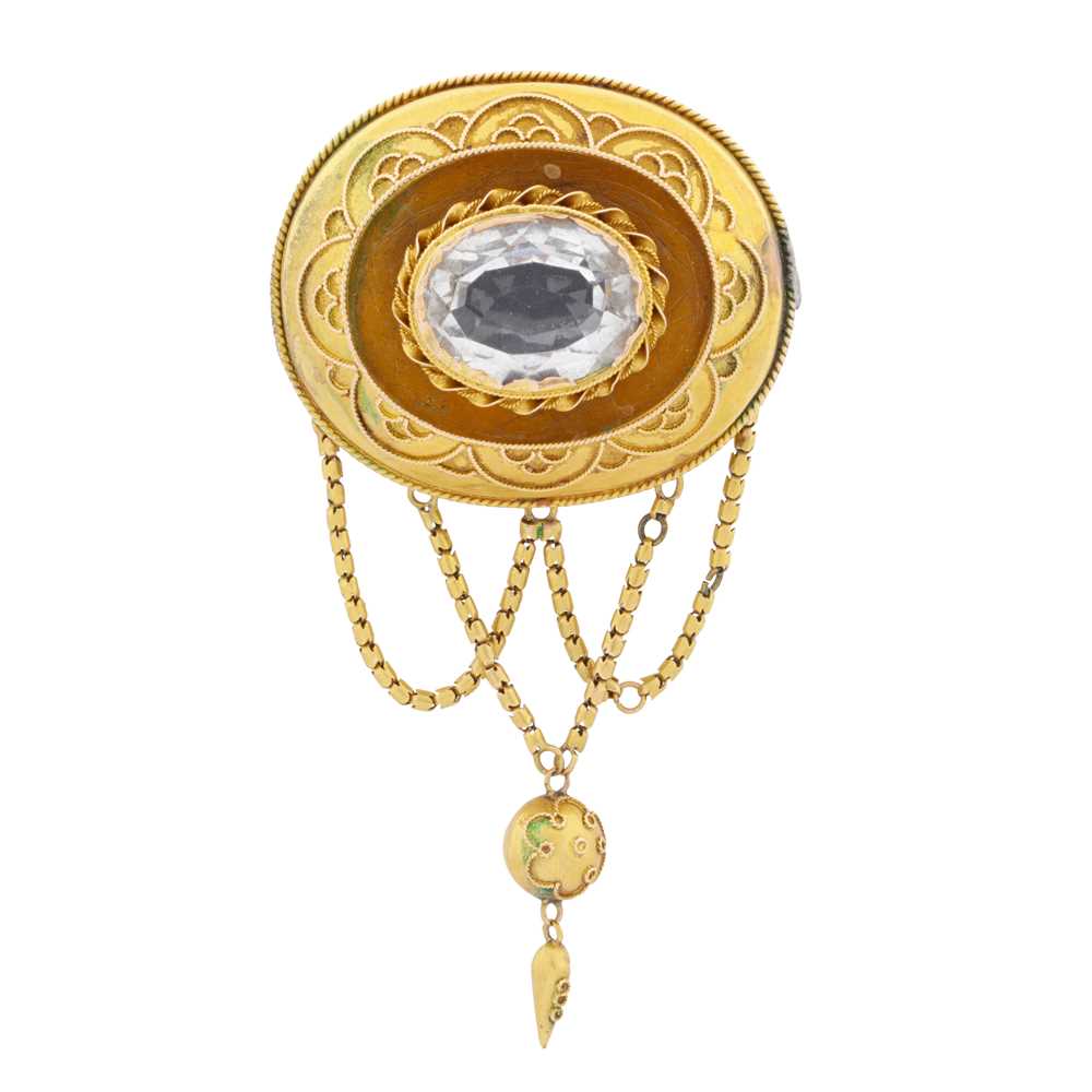 Lot 6 - A rock crystal ornate oval brooch