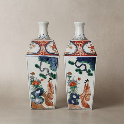Lot 21 - Pair of Japanese Arita Imari 'figural' tokkuri square-form sake bottles, Meiji period, 19th century