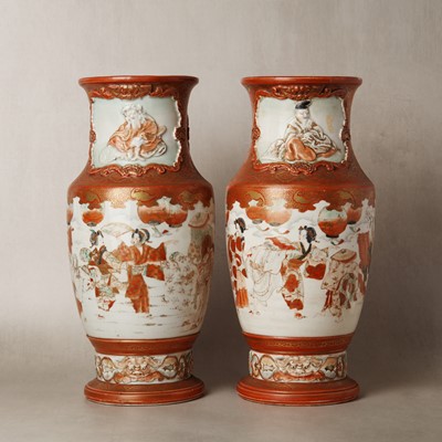 Lot 18 - A pair of Japanese Kutani moulded 'festival' vases, Meiji period, 19th century