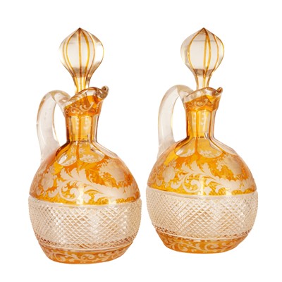 Lot 327 - A pair of Bohemian amber flash glass decanters