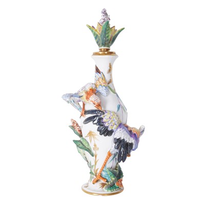 Lot 276 - A Paris porcelain perfume bottle with exotic bird relief decoration