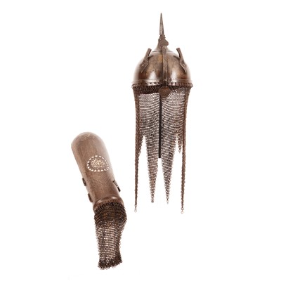 Lot 252 - A Revival Persian Silver Helmet (Kulah Khud) and arm guard on stand