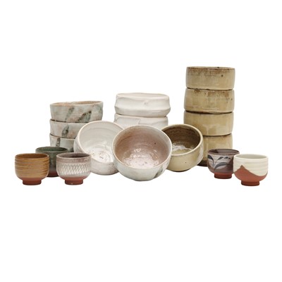 Lot 48 - A large group of Japanese stoneware bowls and cups, 20th/21st century