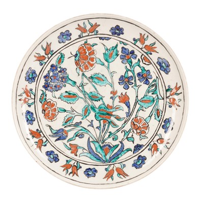 Lot 223 - An Iznik style polychrome pottery dish