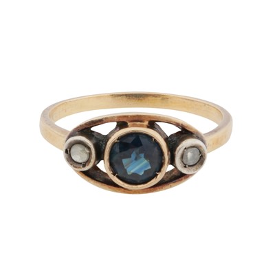 Lot 18 - A sapphire and diamond three stone ring