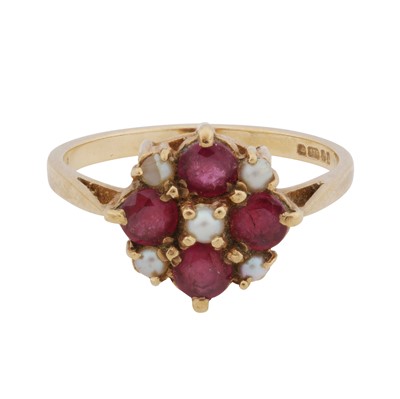 Lot 46 - A ruby and seed pearl cluster ring