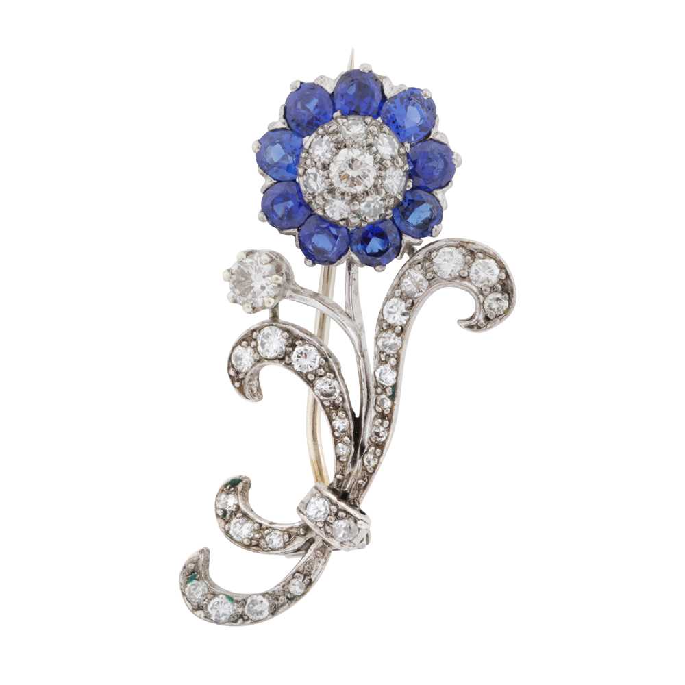 Lot 60 - A sapphire and diamond flower brooch