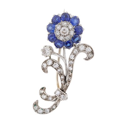 Lot 60 - A sapphire and diamond flower brooch