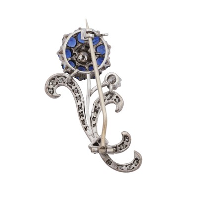 Lot 60 - A sapphire and diamond flower brooch