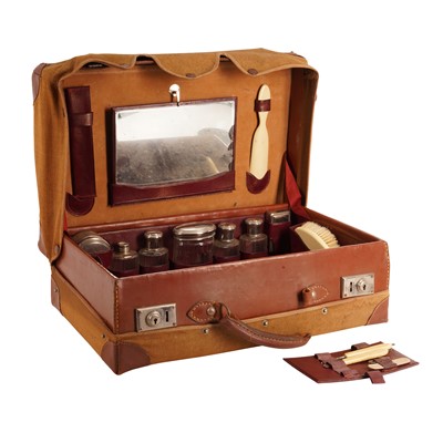 Lot 769 - An Edwardian Leather and Canvas Travelling dressing case