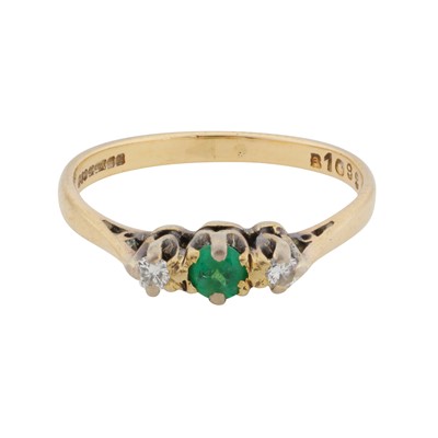 Lot 170 - An emerald and diamond three stone ring