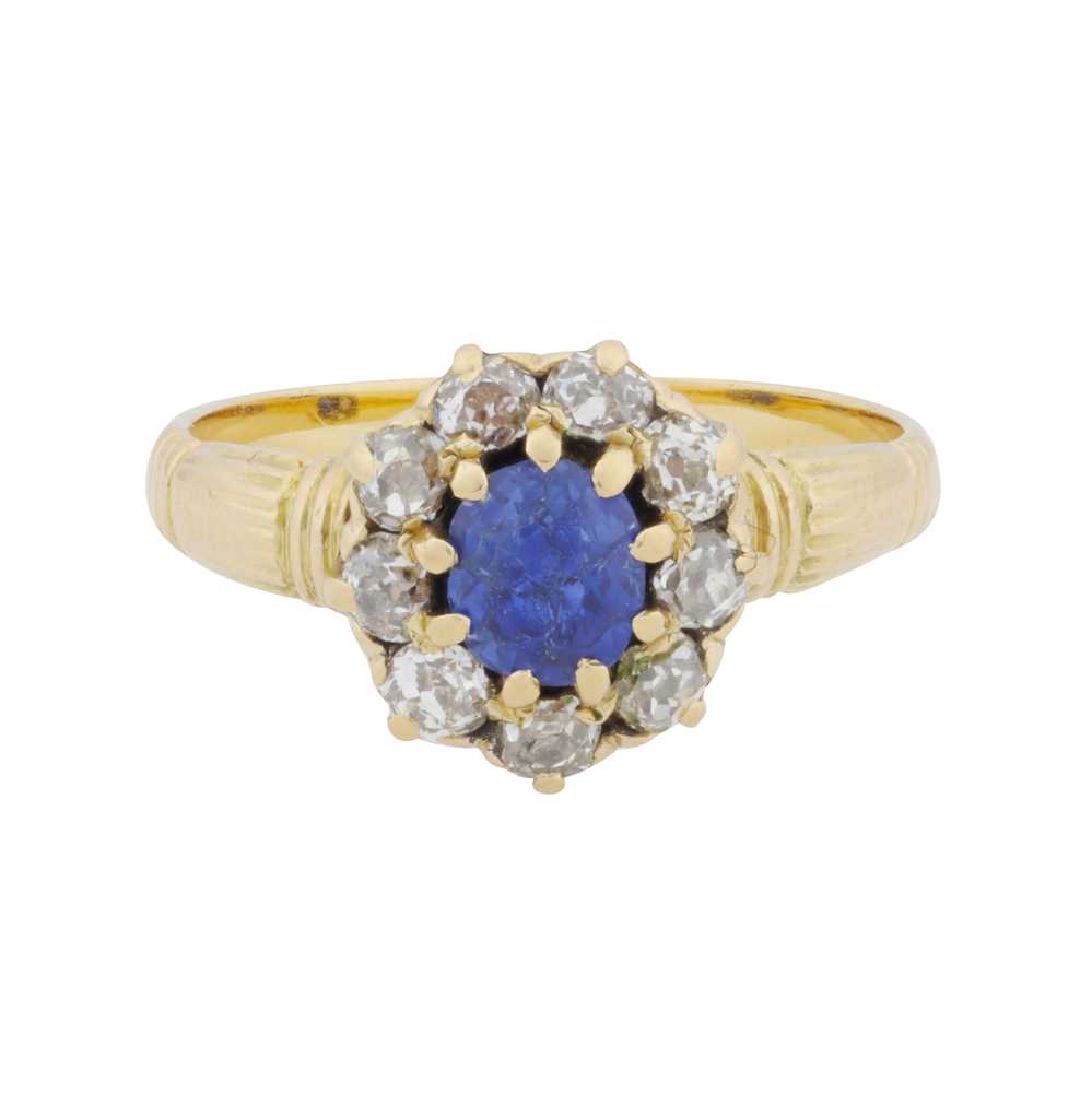 Lot 37 - A sapphire and diamond halo ring