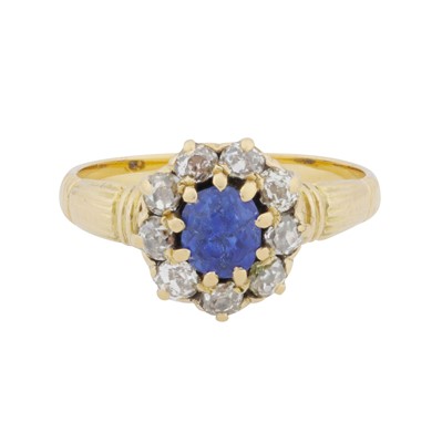 Lot 37 - A sapphire and diamond halo ring
