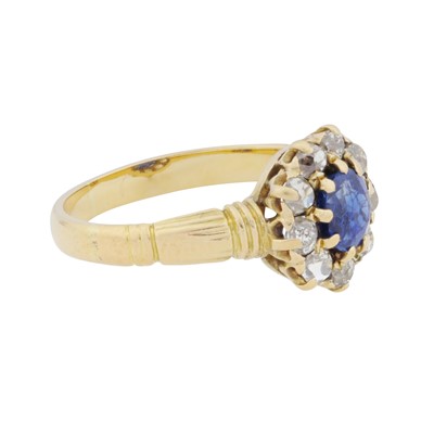 Lot 37 - A sapphire and diamond halo ring