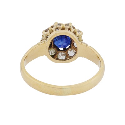 Lot 37 - A sapphire and diamond halo ring
