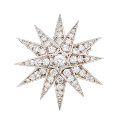 Lot 329 - A diamond star set brooch