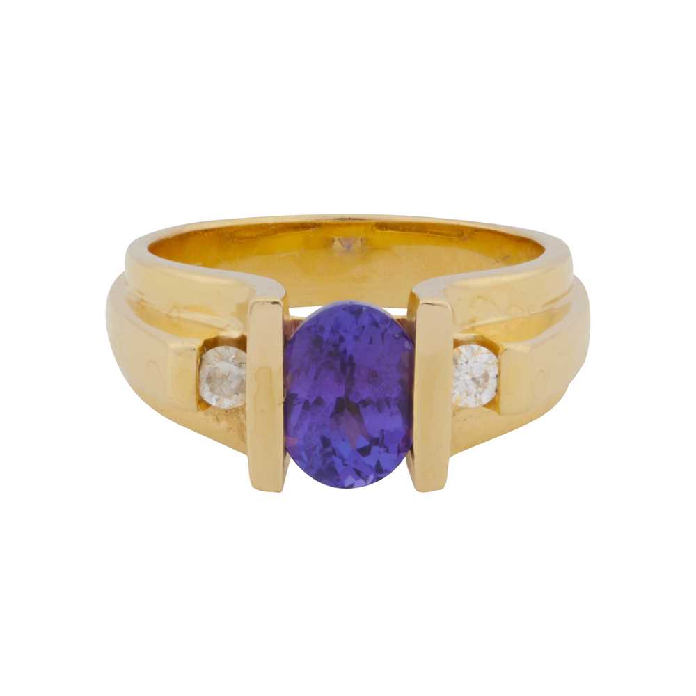 Lot 45 - A tanzanite and diamond three stone ring