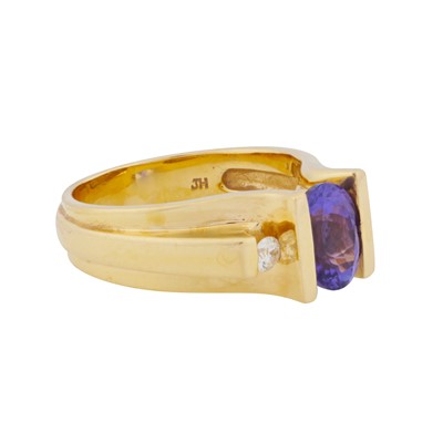 Lot 45 - A tanzanite and diamond three stone ring