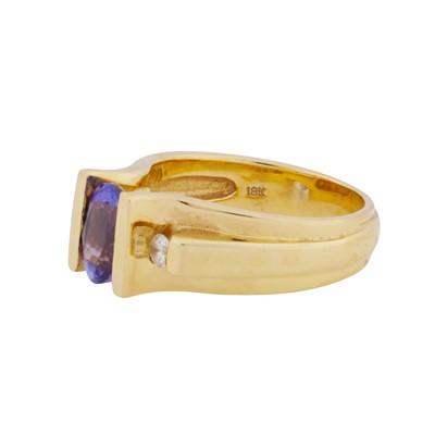 Lot 45 - A tanzanite and diamond three stone ring