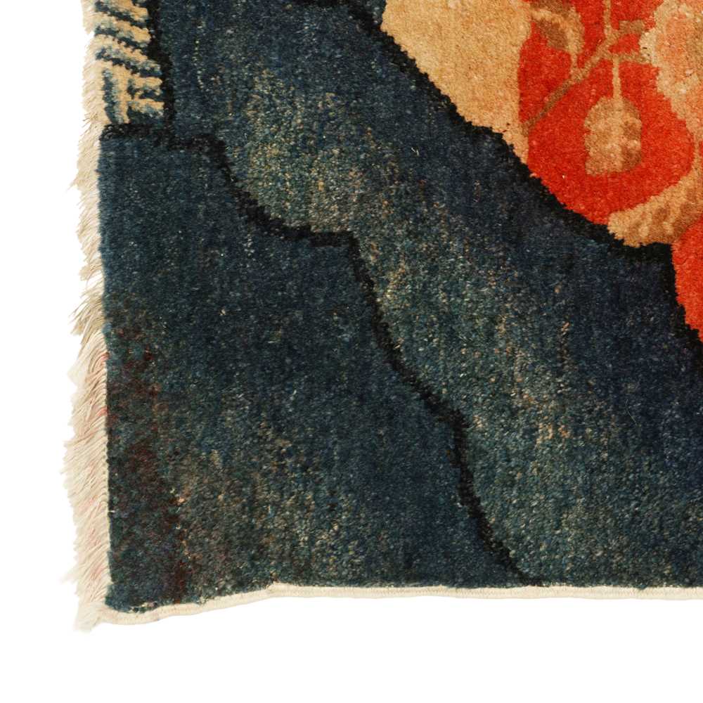Lot 158 - A Chinese Ningxia red-ground 'tiger' rug,