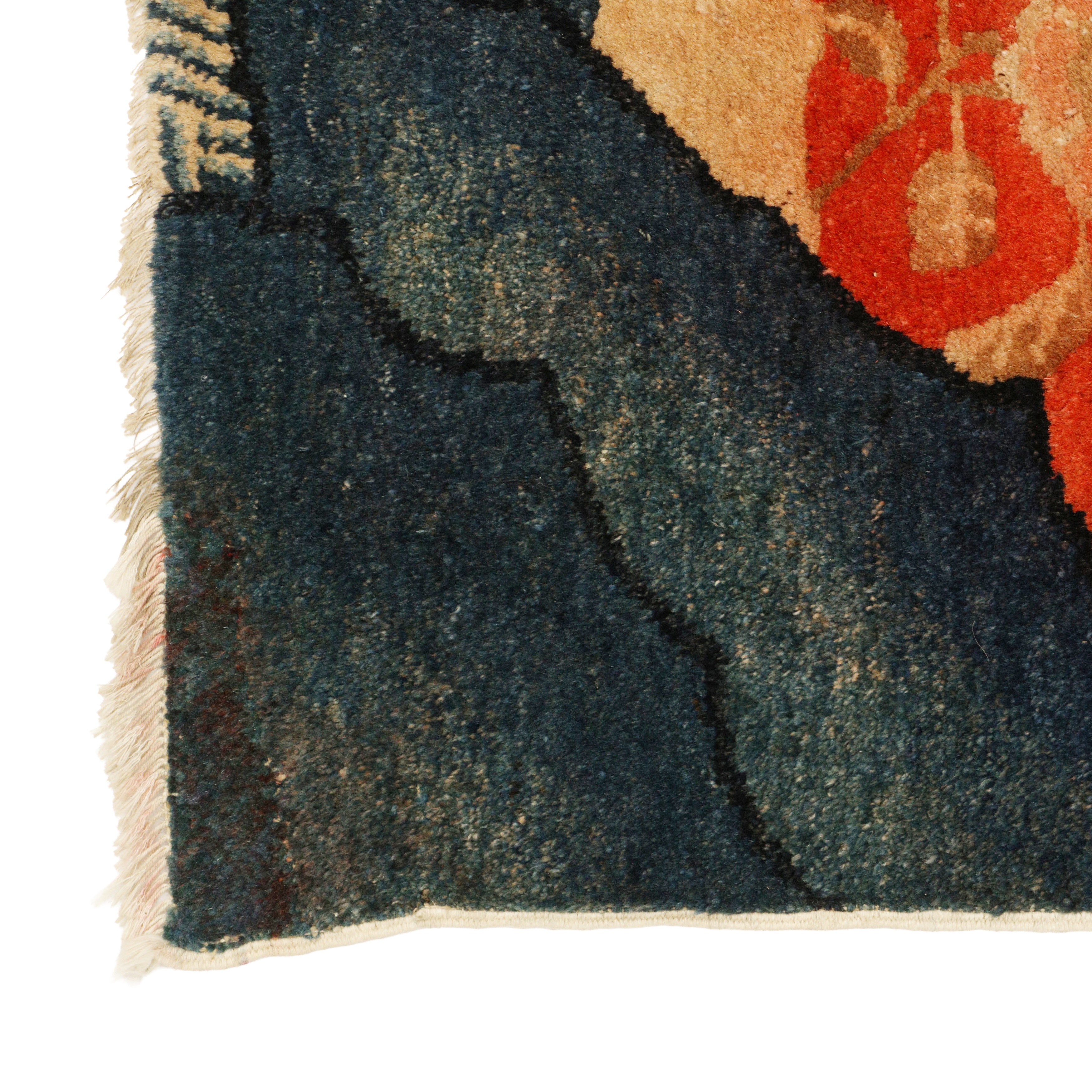 Lot 158 - A Chinese Ningxia red-ground 'tiger' rug,