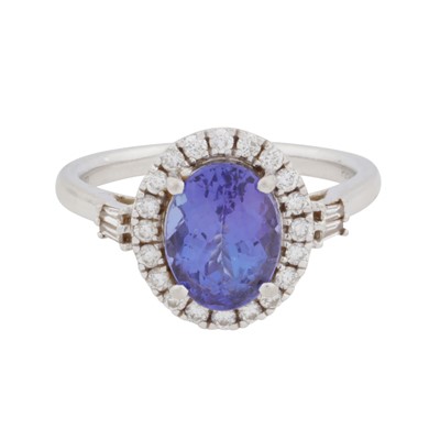 Lot 63 - Rhapsody | A tanzanite and diamond halo ring
