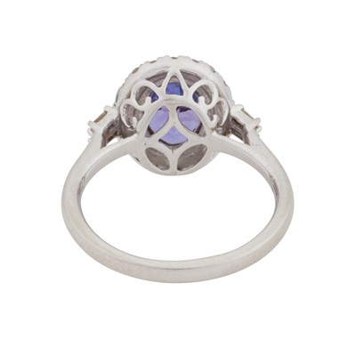 Lot 63 - Rhapsody | A tanzanite and diamond halo ring