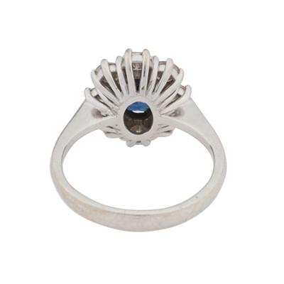 Lot 59 - A sapphire and diamond cluster ring