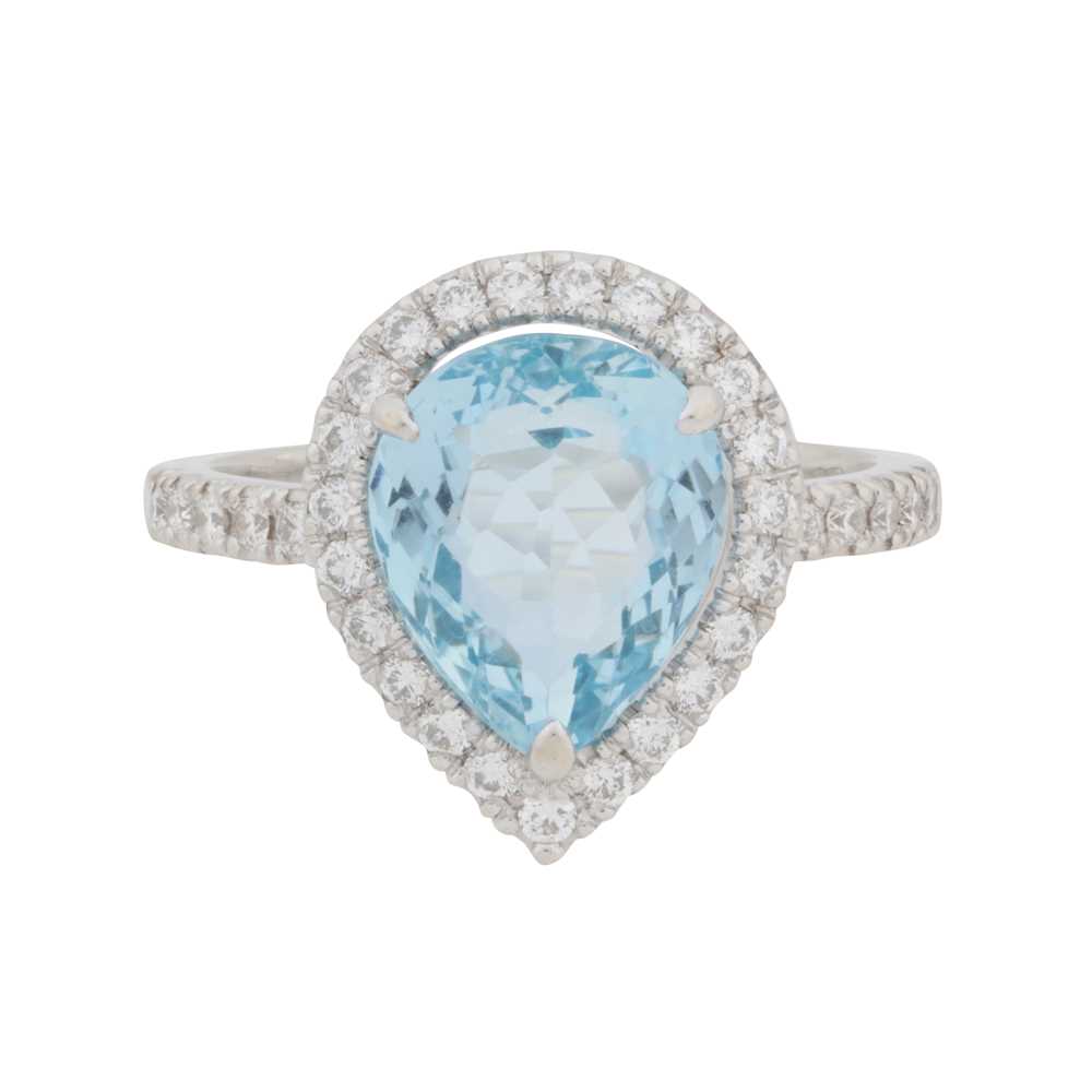 Lot 71 - A topaz and diamond halo ring