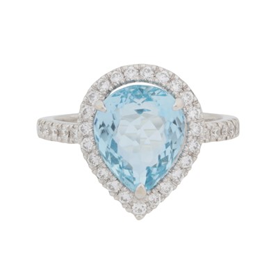 Lot 71 - A topaz and diamond halo ring