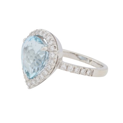 Lot 71 - A topaz and diamond halo ring