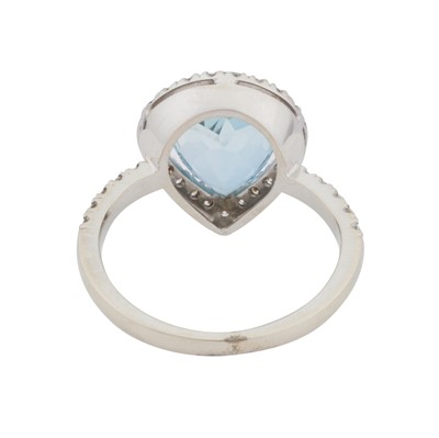 Lot 71 - A topaz and diamond halo ring
