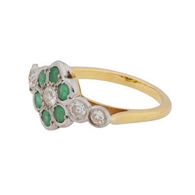 Lot 93 - An emerald and diamond flower ring