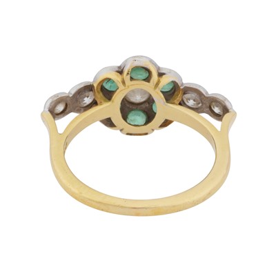 Lot 93 - An emerald and diamond flower ring
