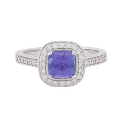 Lot 65 - A diamond and tanzanite halo ring, circa 2011