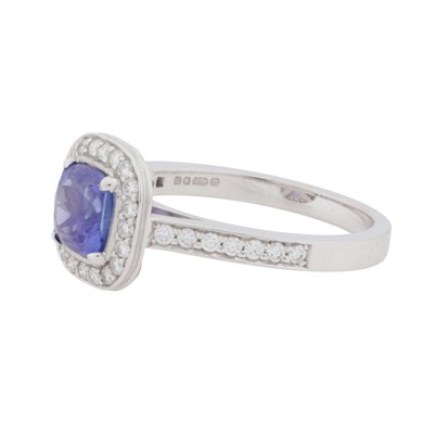 Lot 65 - A diamond and tanzanite halo ring, circa 2011