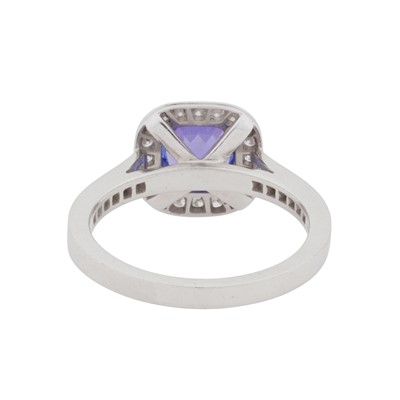 Lot 65 - A diamond and tanzanite halo ring, circa 2011